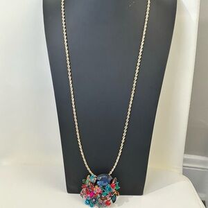 The limited very long necklace with huge rhinestone pendant and also brooch